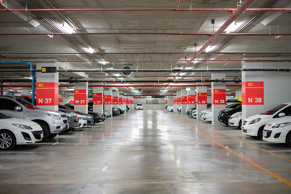 Parking garage full of vehicles with wireless connectivity enabled by wireless boosters from RFE Communications