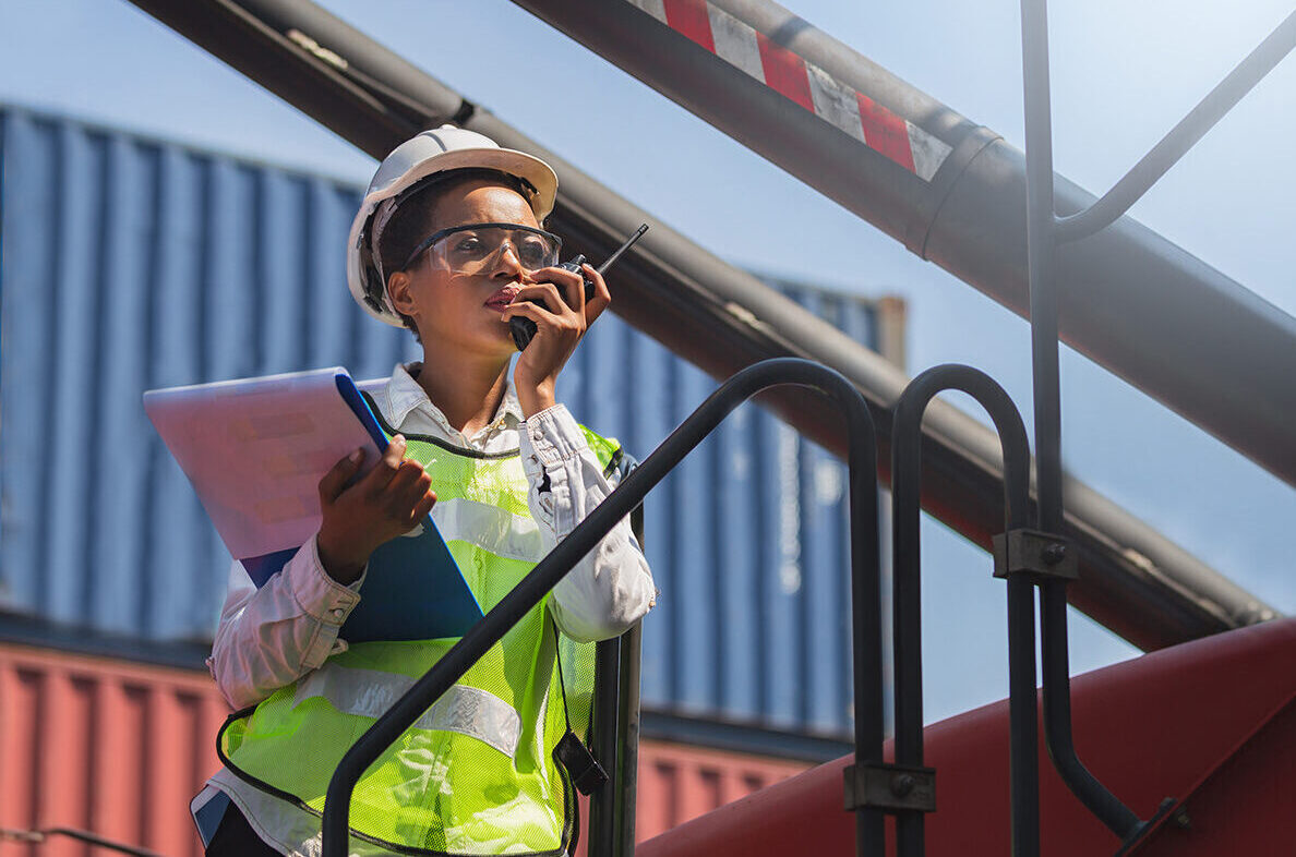 Woman using extended two-way radio coverage Installed By: RFE Communications