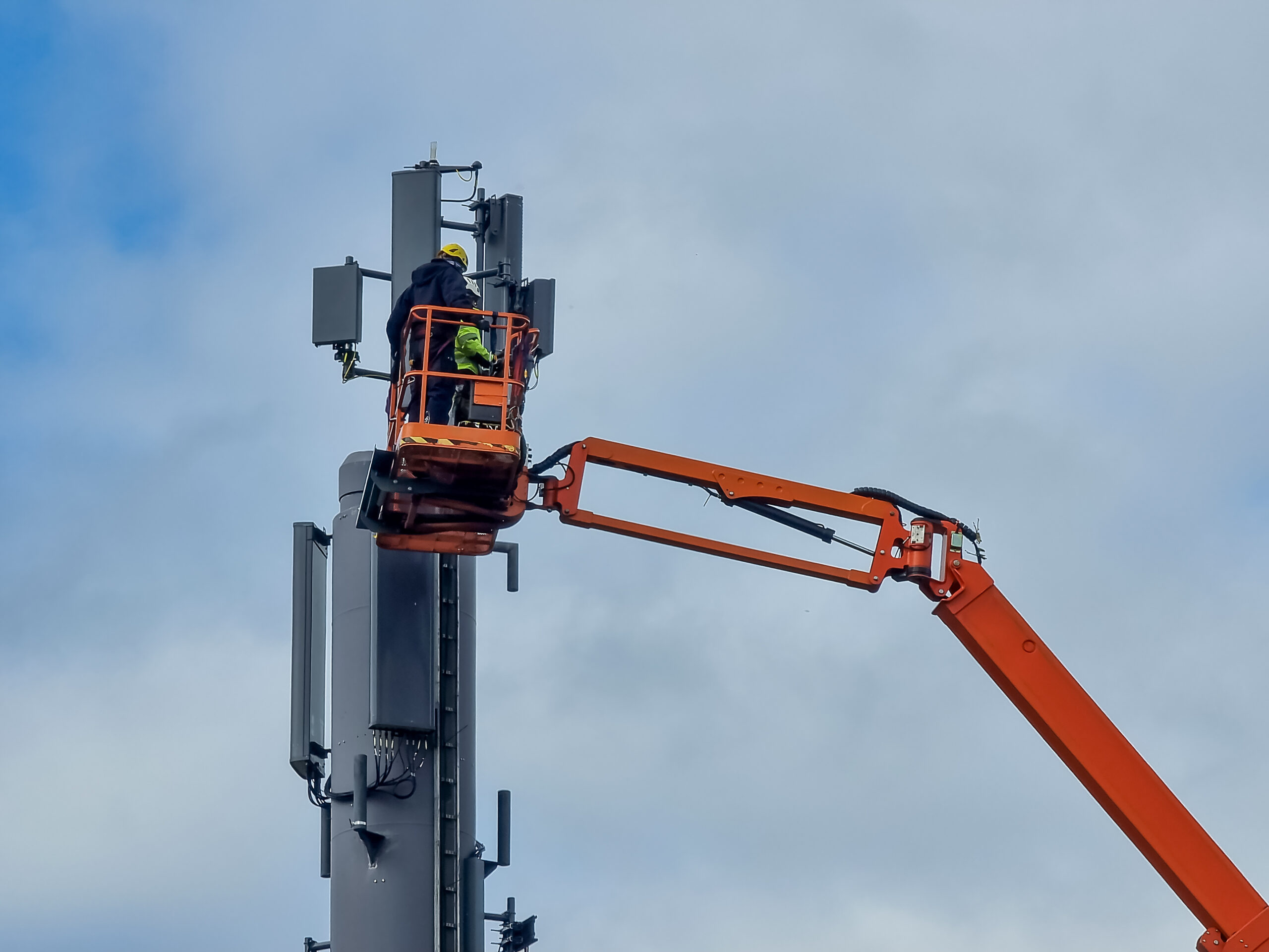 Technician installing antenna By: RFE Communications