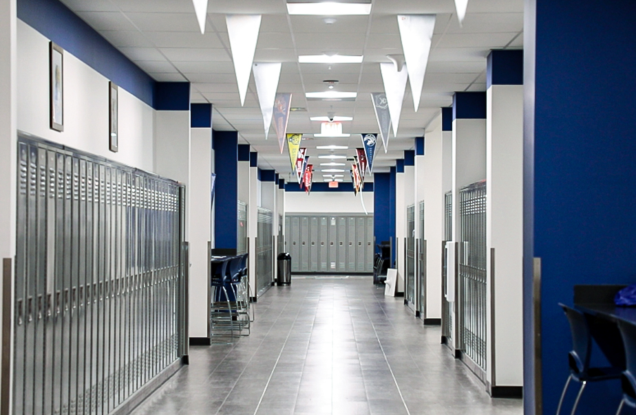 Hallways with the capability to connect to first responders and first responders connecting with each other in a school that had installations from RFE Communications.
