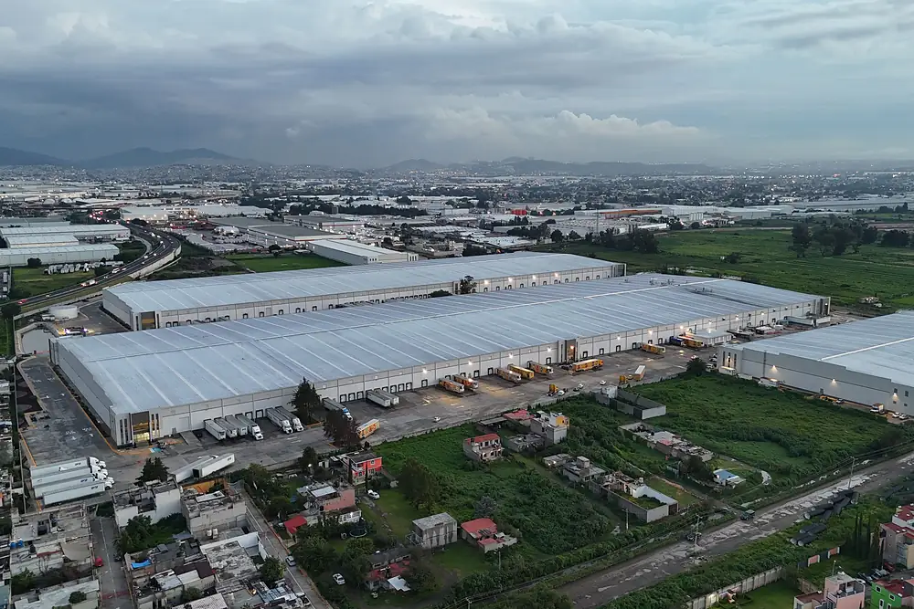 errcs-industrial-manufacturing Aerial view of large industrial warehouse buildings with truck loading docks
