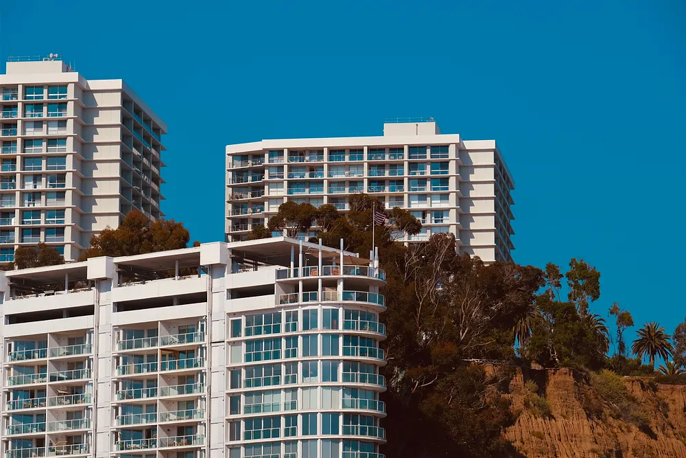 errcs-multifamily-apartments High-rise apartment buildings with glass balconies on a coastal bluff